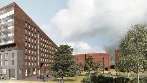 A verdant park, bordered by a new red-brick residential building and Olari Church.