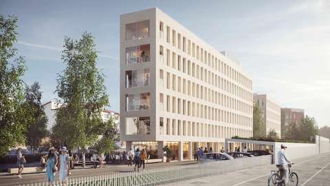 A new block of flats placed in the planning area. The facades of the building are light-coloured. A quality cycling route runs nearby.