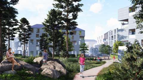 Flervåningshus. I förgrunden park och en gång- och cykelbana.