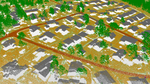 En landskapsbild som ser kornig ut, där markytan, gatorna, byggnadernas tak, växtligheten och andra objekt har skiljts åt med olika färger.