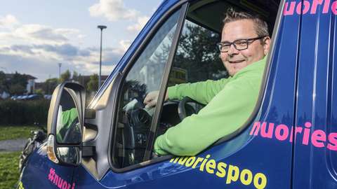 Jukka Kilpelä behind the wheel of the mobile youth work van.