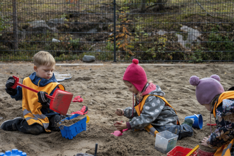 The children are playing in the sandbox.