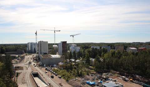 High-rise buildings, cranes and construction sites.