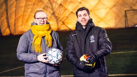Sanni Castrén and Bajram Peci are looking smiling towards camera.