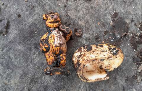 Dirty plastic items against a grey background.