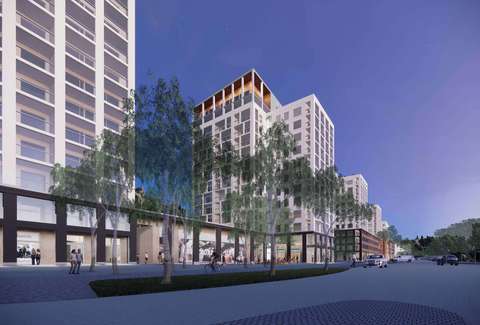 The buildings on Tiilismäenrinne line new squares and Ruukintie. The lower buildings have brick facades. The taller buildings have brick facades at the base and their middle parts and tops are light.