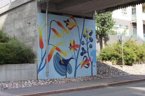 The mural features various colorful plants and flowers.