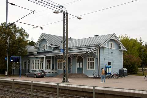 Kauklahti station building with train tracks in the foreground.