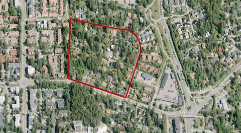 Alt text	The aerial image shows buildings, streets and plenty of green urban areas.