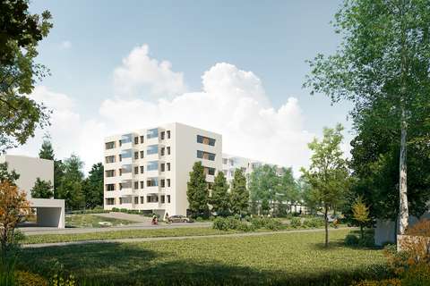 Vaaleat kerrostalot sijaitsevat hieman kauempana kadusta viheralueen takana.