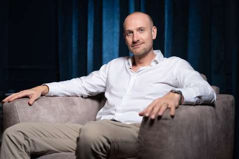 Max Seeck sitting in an armchair.