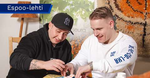 Otto Vuolle and Sylvester are playing a board game.
