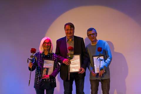 The top three winners of the "A Glance at Espoo" poetry competition. From left: second-place winner Liisa Kauppinen, winner Jyrki Laine, and third-place winner Martin Westman.