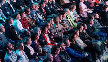 People sitting in an audience.