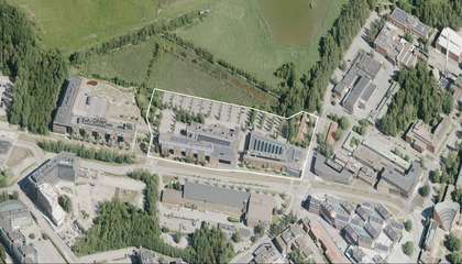 The aerial photograph shows the plan area. 3- and 4-storey higher education buildings by Maarintie are visible in the foreground. There is a large parking area in the northern part of the plan area, behind the buildings.